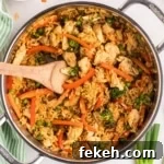 Fresh Chicken Recipes for Summer Grilling and Light Meals 6 A pan of fried rice with veggies and chicken.