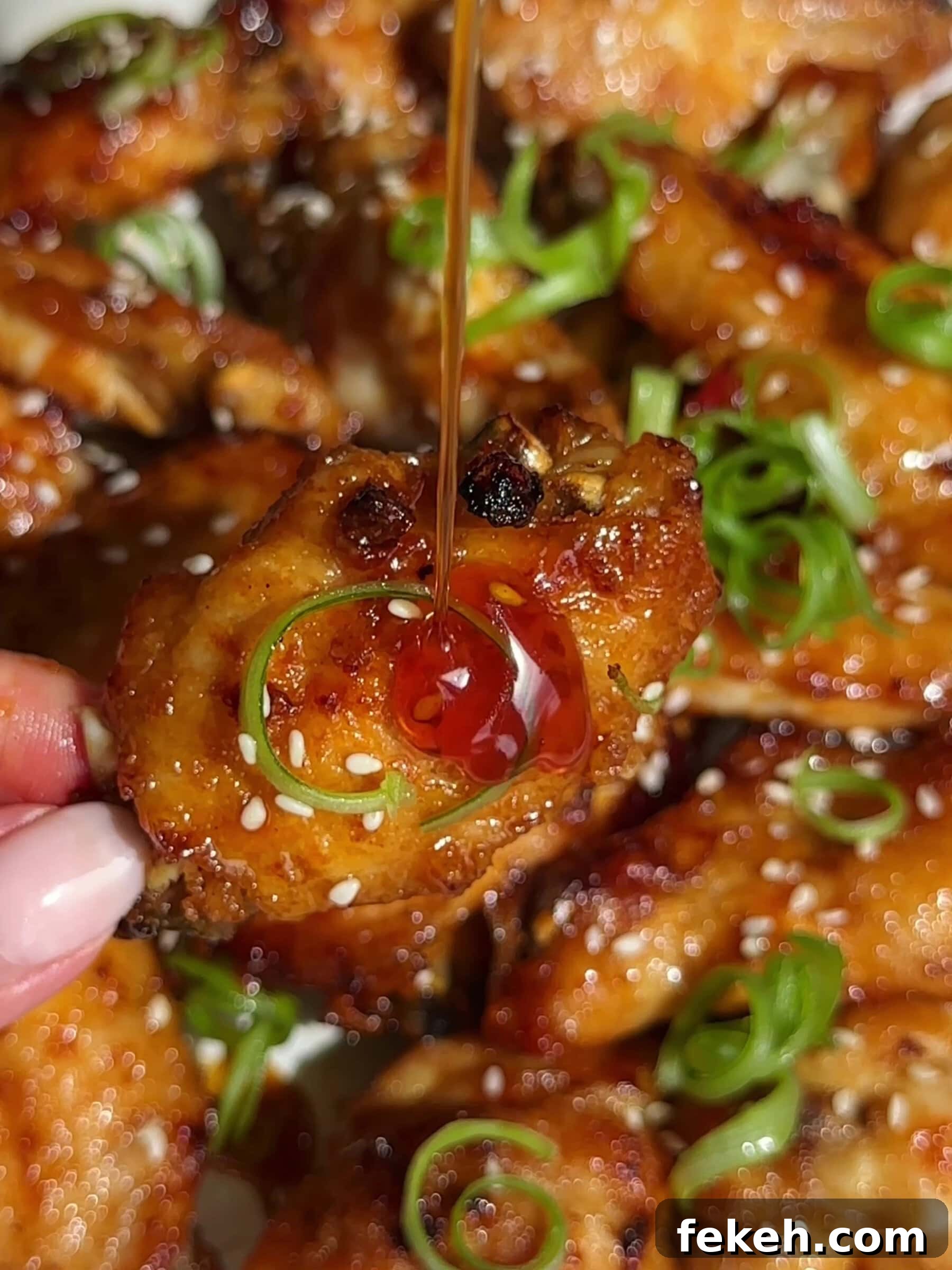 Homemade Hot Honey Recipe: Spicy Sweet Sauce for Pizza & More 3 Hot Honey Chicken Wings drizzling with hot honey.
