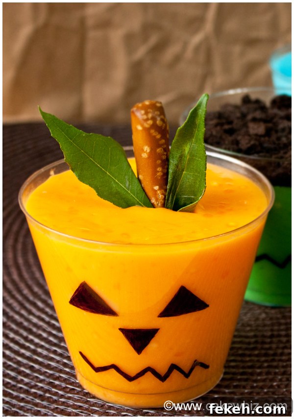 Halloween Pudding Cups: Spooky Dessert Cups for Party Treats 2 Jack O'Lantern Pudding Cups on Brown Background