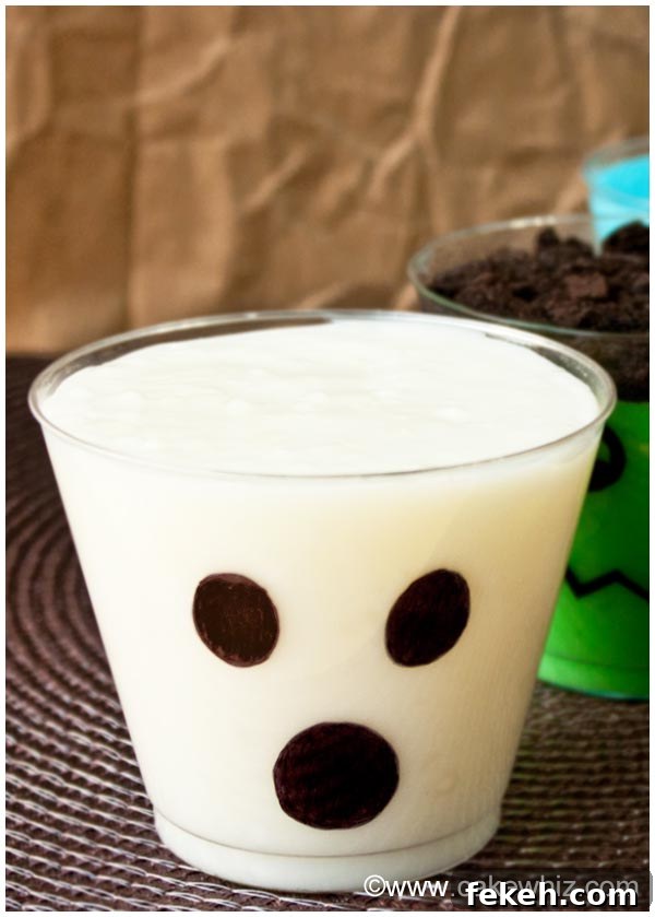 Halloween Pudding Cups: Spooky Dessert Cups for Party Treats 5 Ghost Pudding Cups on Brown Background