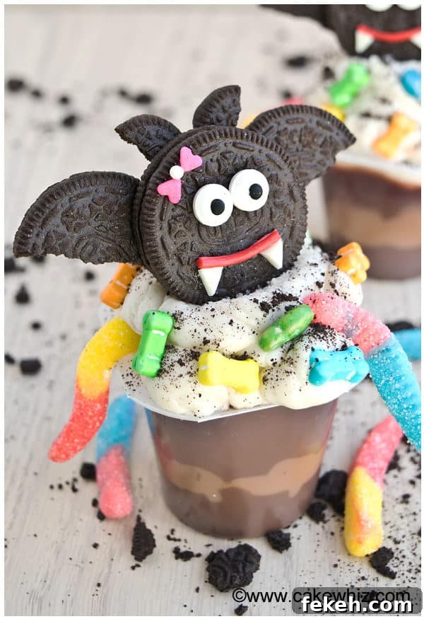 Halloween Pudding Cups: Spooky Dessert Cups for Party Treats 6 Halloween Dracula Pudding Cups on Rustic Gray Background