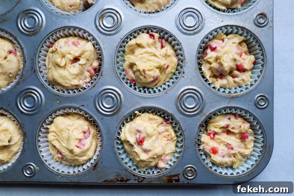 Strawberry Coconut Muffins with Crunchy Streusel Topping 5 Batter in muffin tin