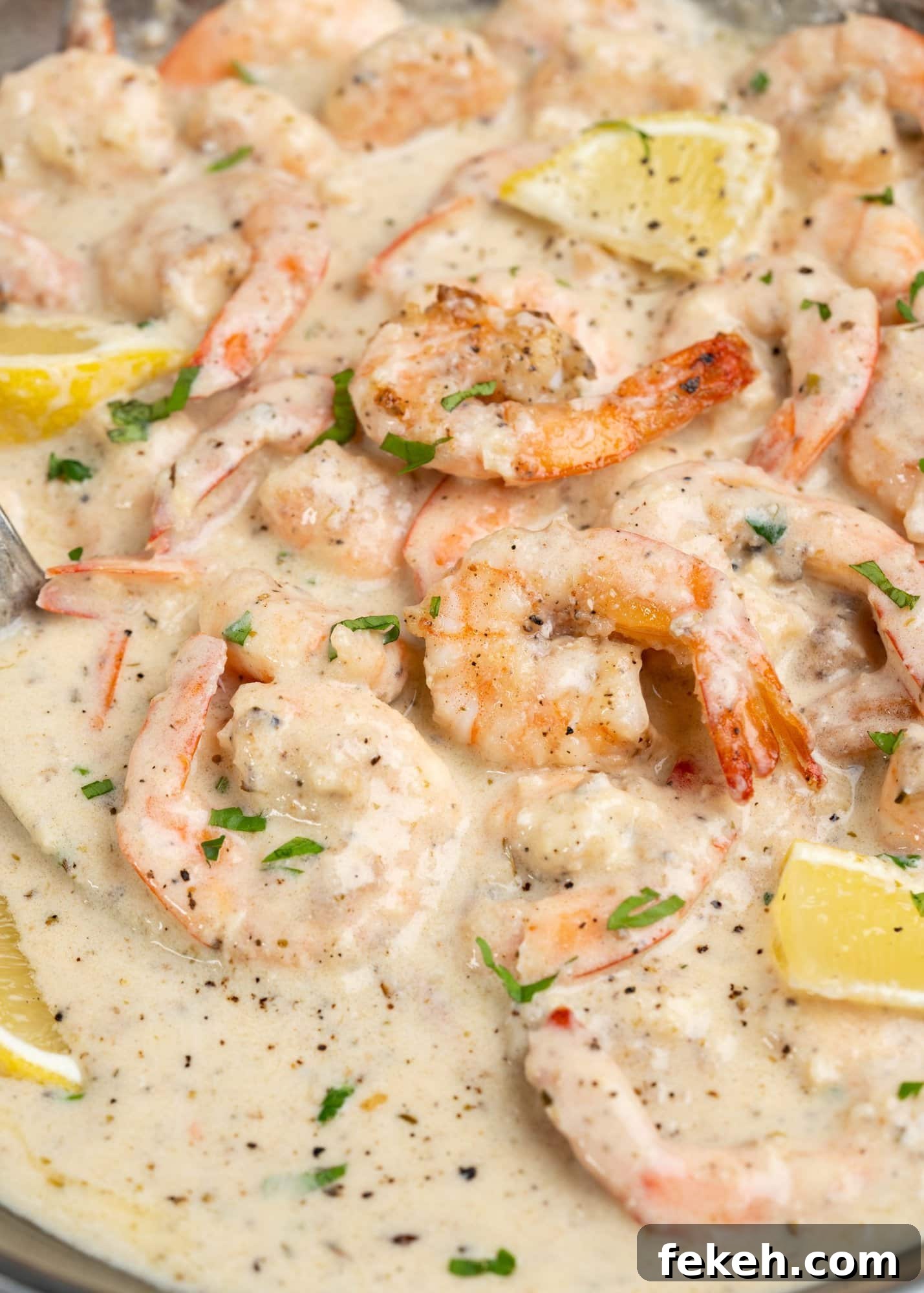 Creamy Garlic Shrimp Pasta Recipe — Quick Garlic Butter Shrimp 3 Shrimp coated with the creamy sauce and topped with some chopped fresh parsley and lemon slices.