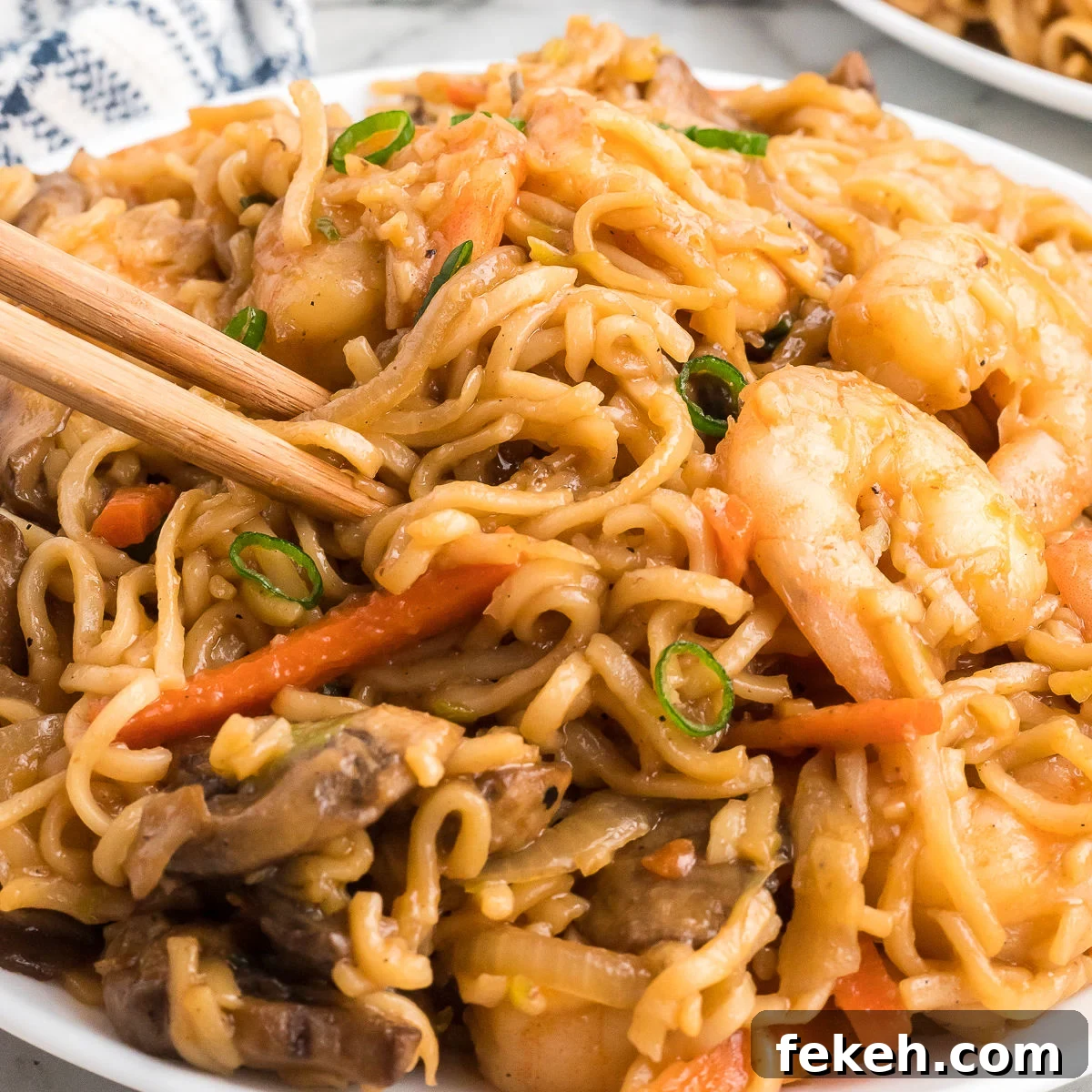 Blackstone Shrimp Yakisoba Recipe — Quick Griddle Noodle Stir-Fry 10 Shrimp Yakisoba on a plate with chopsticks
