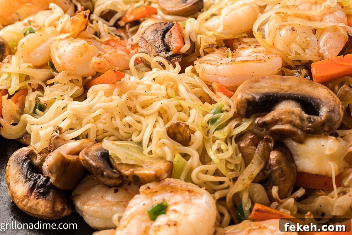 Blackstone Shrimp Yakisoba Recipe — Quick Griddle Noodle Stir-Fry 6 Cooked shrimp, slice mushrooms, carrots and cooked noodles