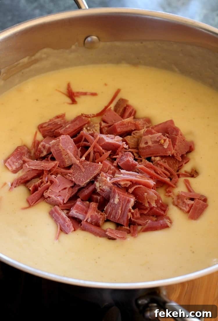 Corned Beef and Potato Chowder is a great way to use up leftover corned beef! Tender potatoes, flavorful corned beef and a touch of cream. Creamy Corned Beef and Potato Chowder gets blended, then you add in your leftover corned beef!