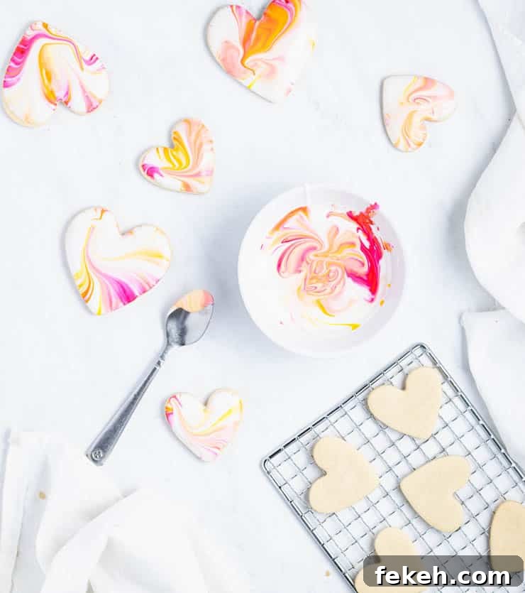 Heart-Shaped Sugar Cookies: Soft, Buttery Recipe for Any Occasion 4 plain cookies on a cooling rack next to a bowl of icing and iced cookies