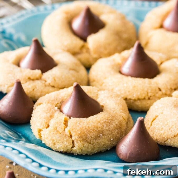 Peanut butter blossoms on a teal decorative plate.