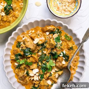 Leftover Turkey Curry Recipe for a Flavorful Dinner 14 Leftover turkey curry in a bowl garnished with cilantro and flaked almonds,