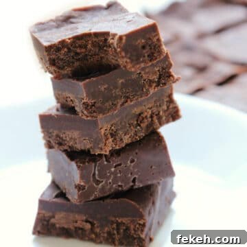 5 pieces of 3 ingredient maple tahini freezer fudge stacked on top of each other