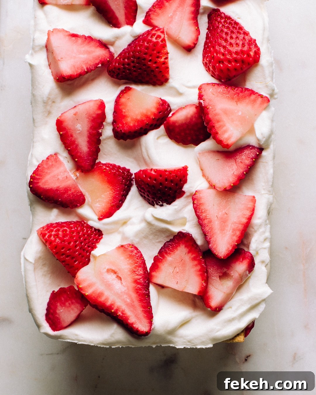 Strawberry Icebox Cake Recipe — No-Bake Summer Dessert 4 A whole strawberry icebox cake before slicing.