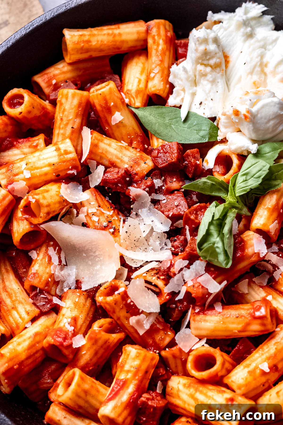 Chorizo rigatoni in a pan with mozzarella.