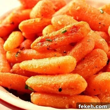 Garlic Parmesan Roasted Baby Carrots with Crispy Edges 2 Roasted Baby Carrots in a bowl.
