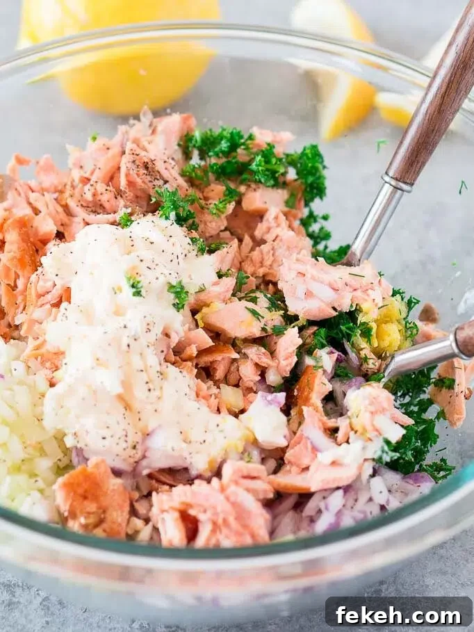 Quick Salmon Salad Recipe for Light, Flavorful Meals 5 cooked salmon and mayo and aromatics in a bowl