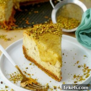 Creamy Pistachio Cheesecake with Real Pistachios and Homemade Paste 20 Pistachio cheesecake slice on white plate