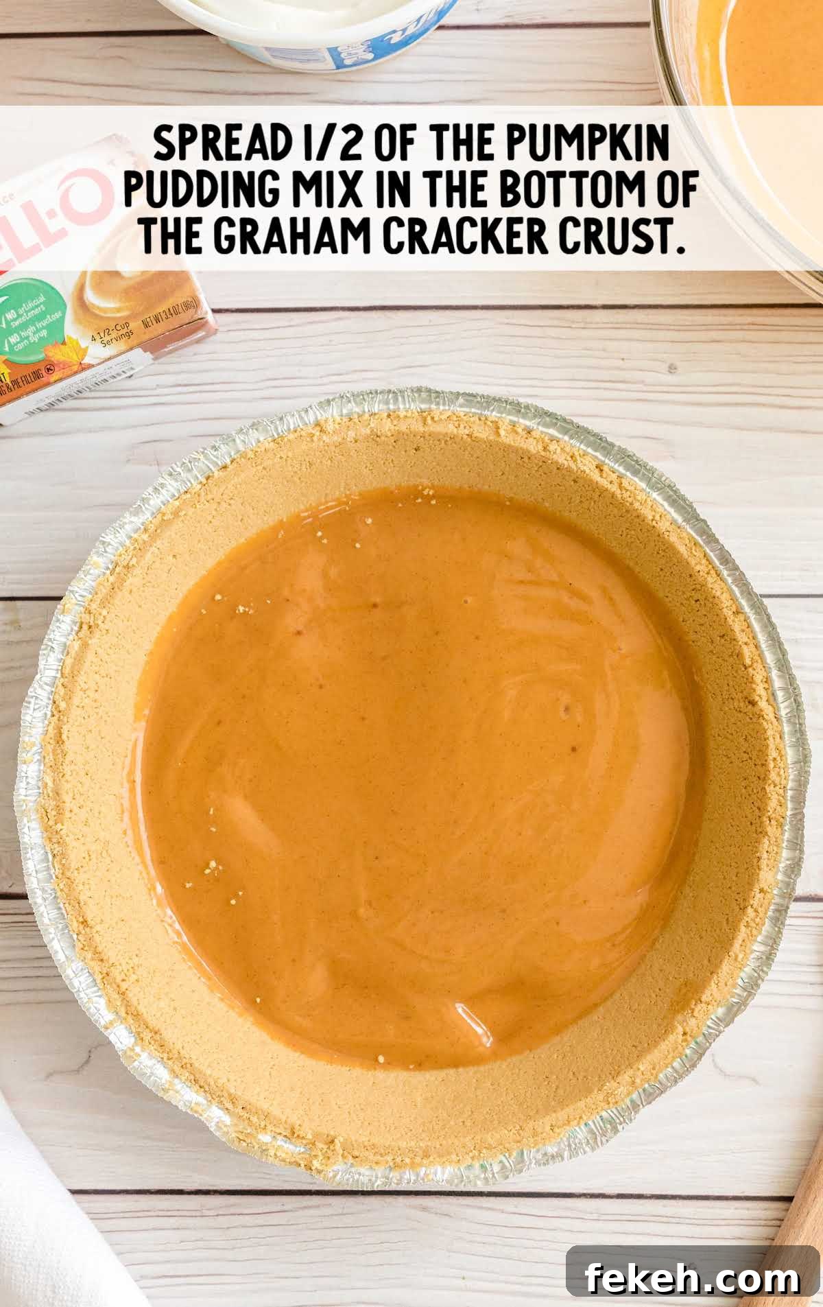 No-Bake Pumpkin Pie with Jello Filling 4 Mixing bowl with creamy orange pumpkin spice filling being whisked together for the pie.