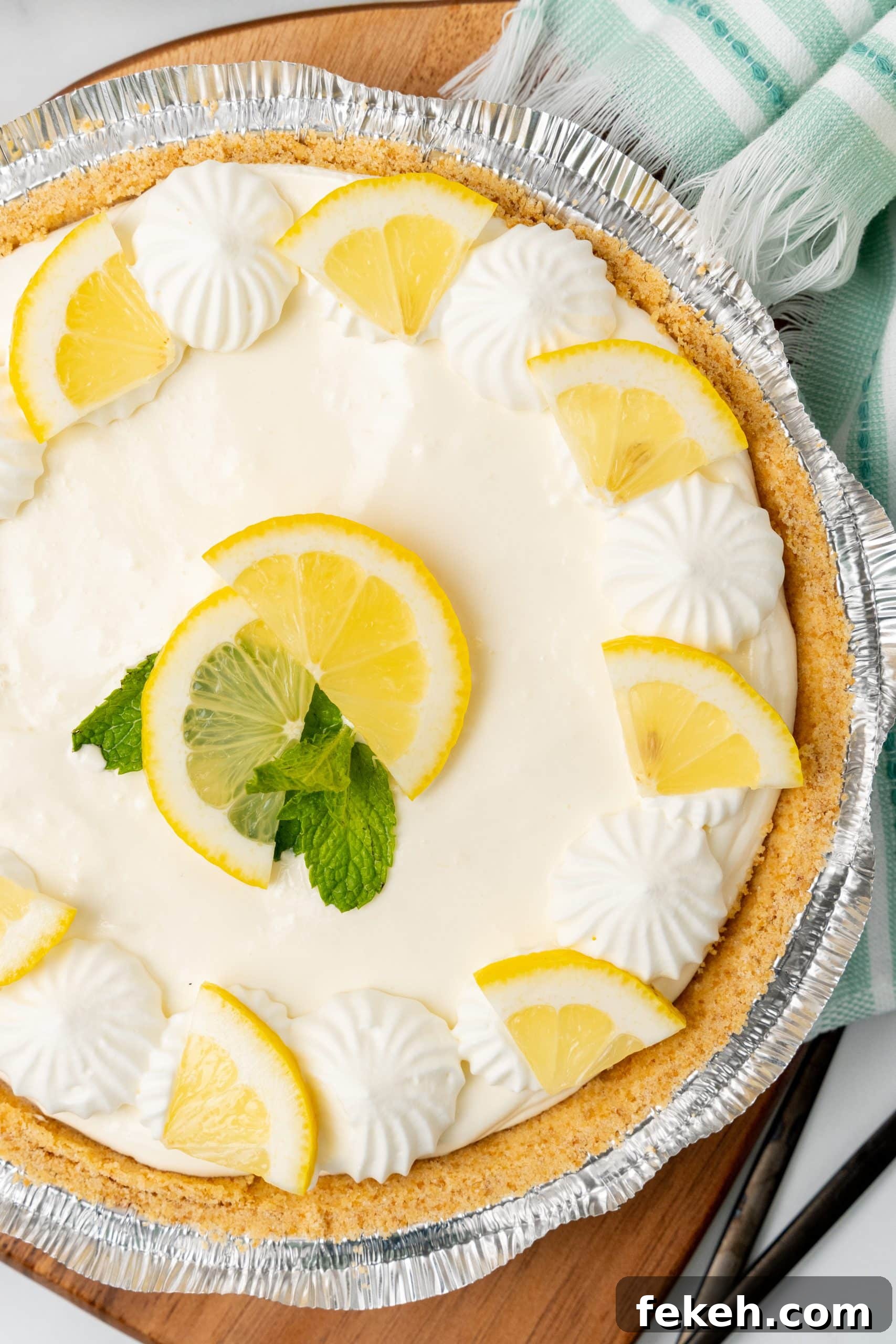 No-Bake Lemonade Cream Pie Recipe: Refreshing Summer Dessert 3 no bake lemonade pie on a wooden cutting board