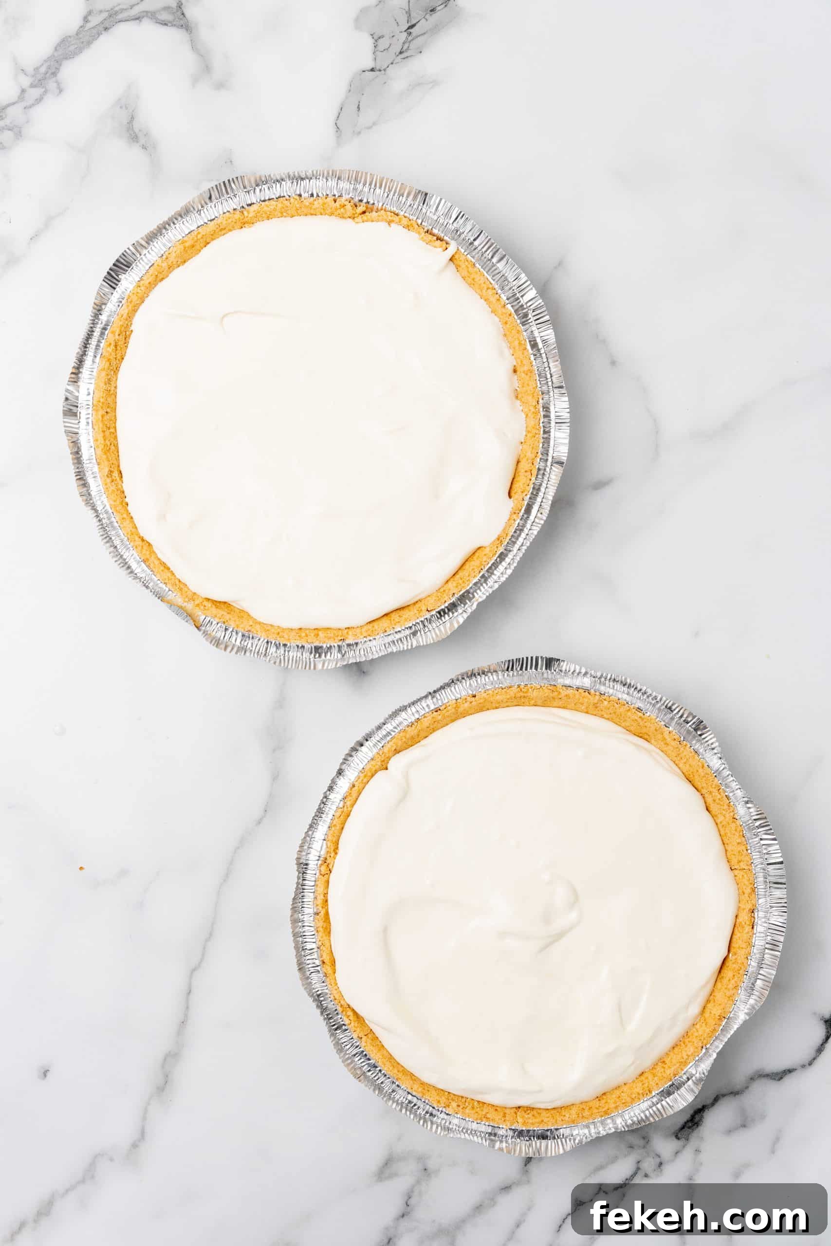 No-Bake Lemonade Cream Pie Recipe: Refreshing Summer Dessert 9 two graham cracker crusts filled with creamy lemonade pie filling