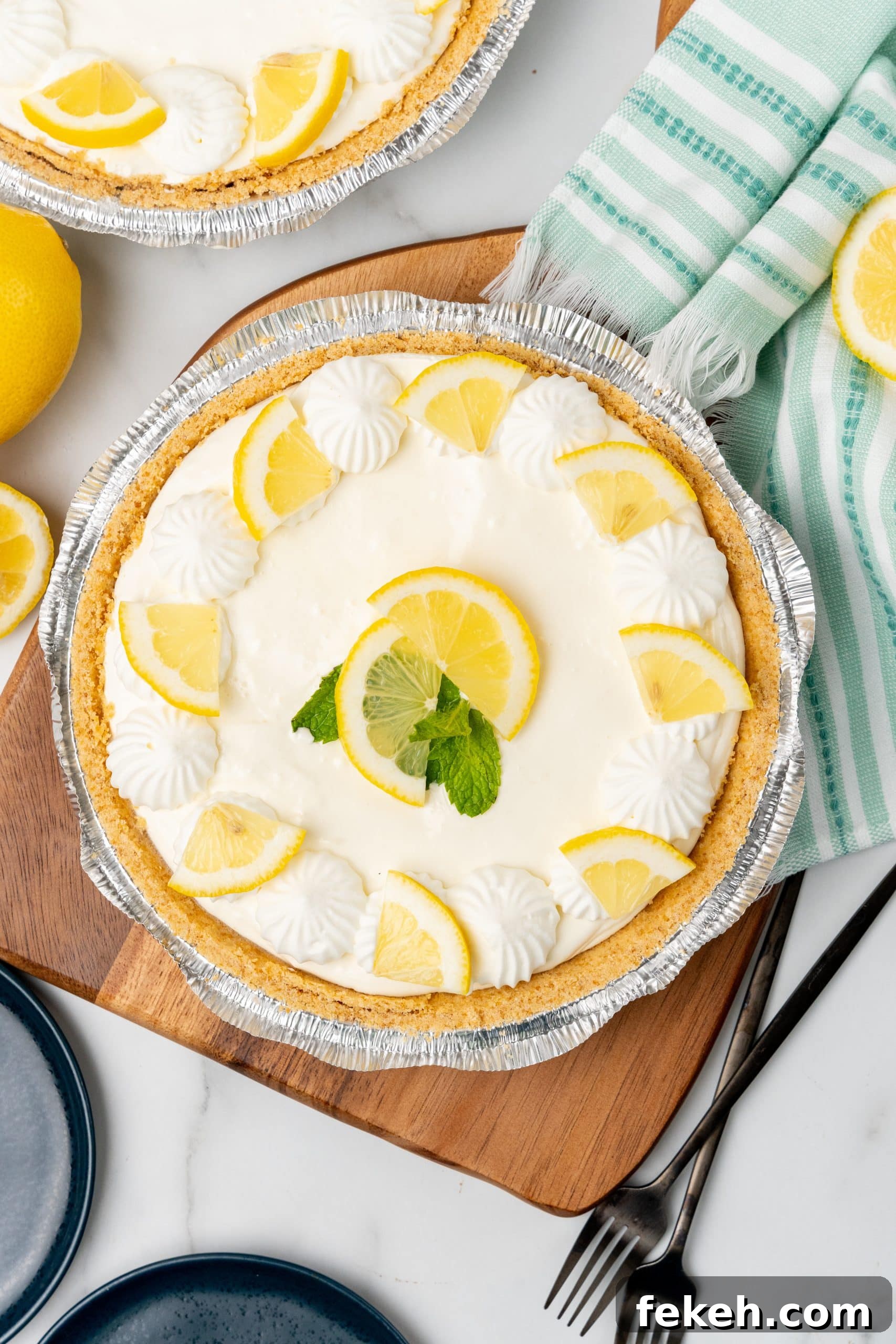 No-Bake Lemonade Cream Pie Recipe: Refreshing Summer Dessert 10 no bake lemonade pie on a wooden cutting board