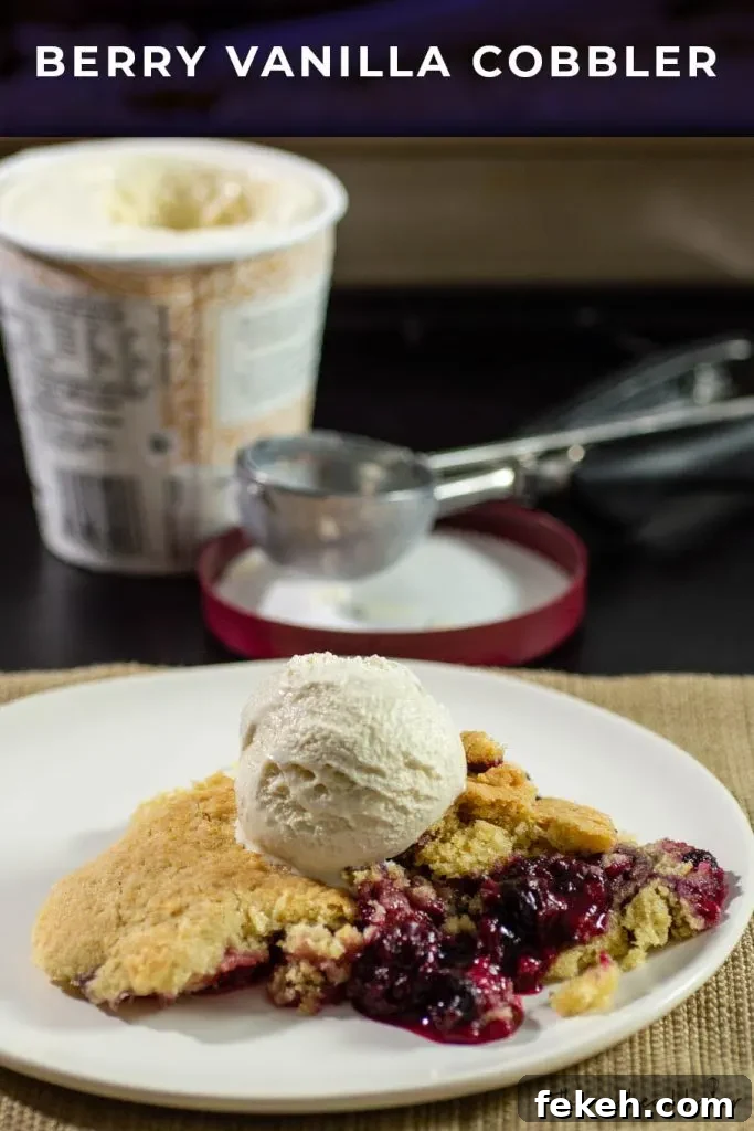 Summery Mixed Berry Cobbler Recipe with Crisp Oat Topping 4 A plate of mixed berry cobbler with a scoop of ice cream in front of the open pint contianer of ice cream