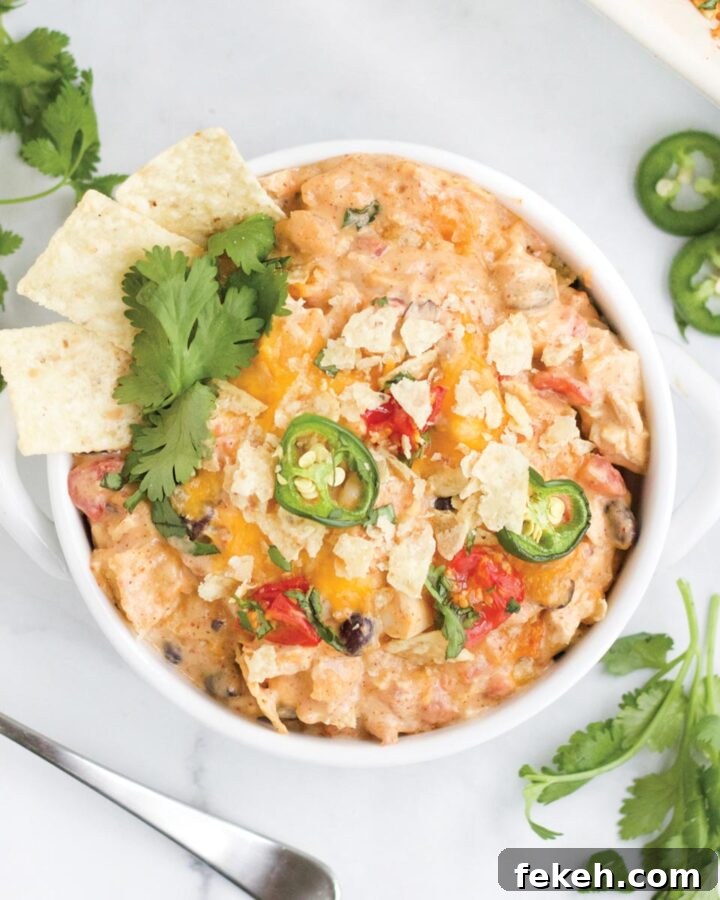 Chicken taco casserole served up in a bowl on the table.