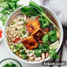 Vegetarian pho soup served in a bowl with lots of toppings