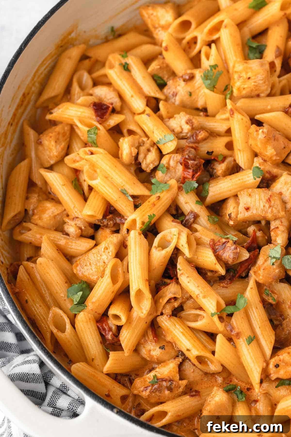 Creamy Chipotle Chicken Pasta Recipe — Smoky Sauce & Quick Dinner 2 Spicy Chipotle Chicken Pasta in a large skillet garnished with fresh parsley