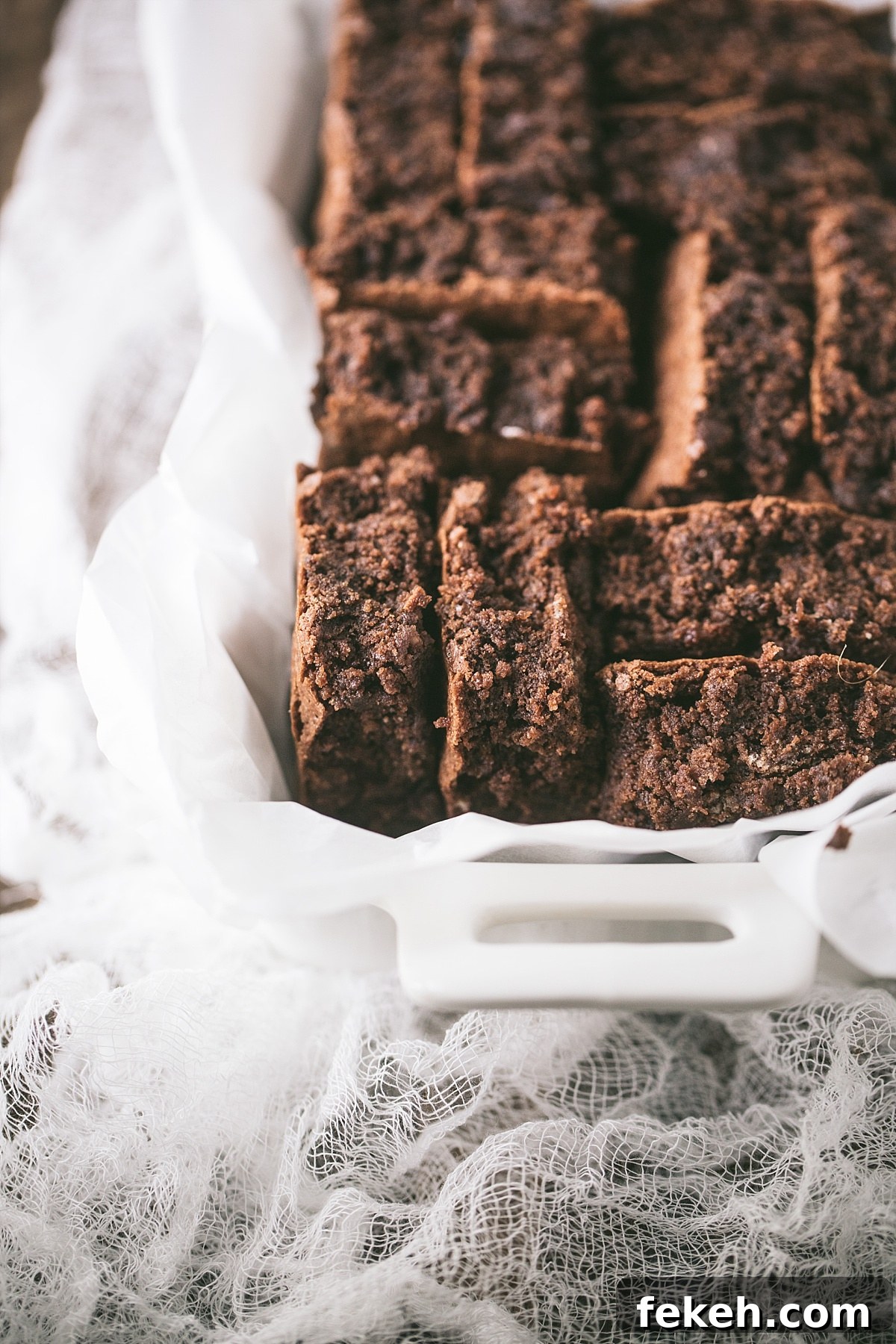 6 of the original baker's brownies in a white container so you can see texture