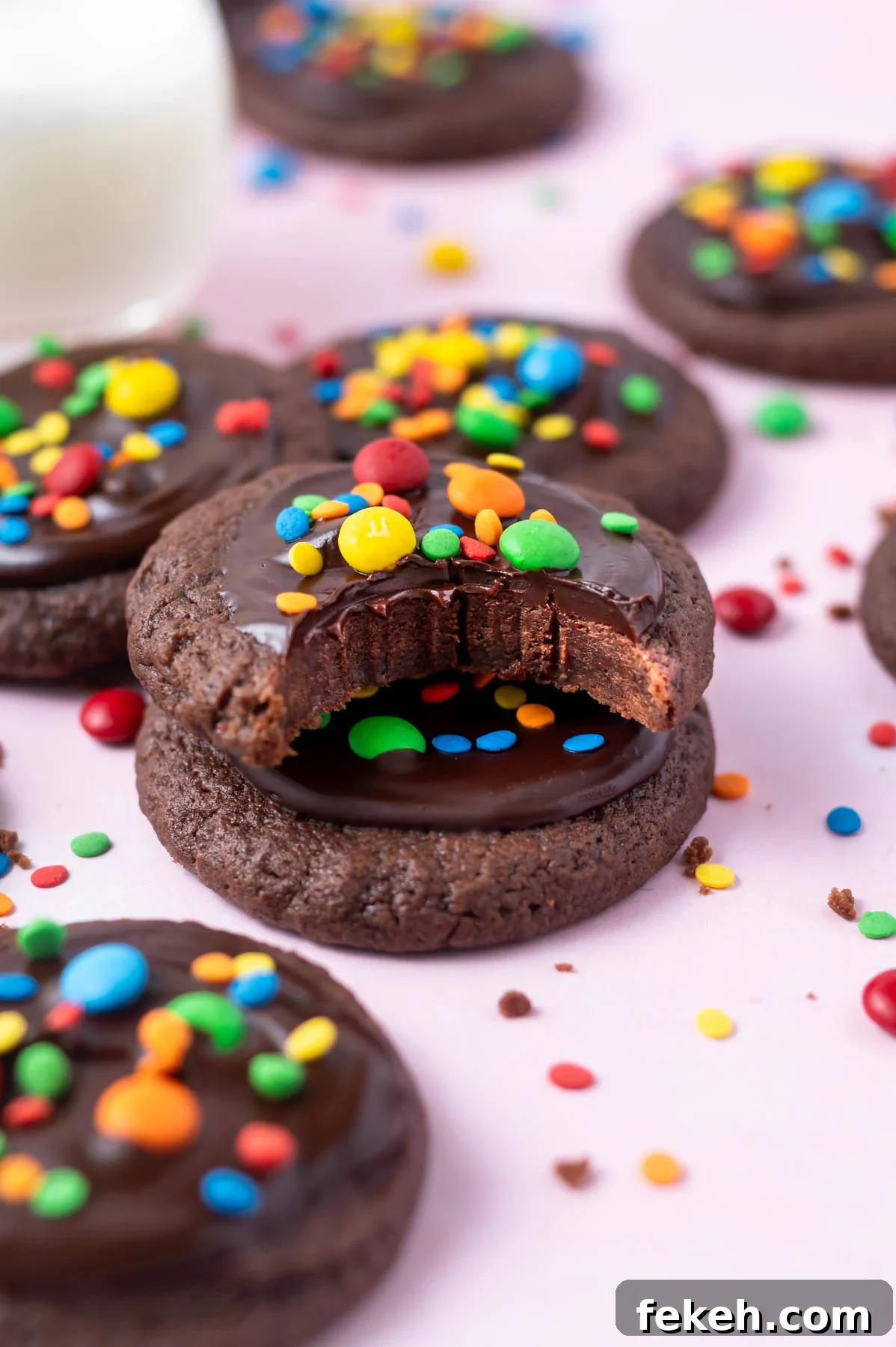Fudgy Cosmic Brownie Cookie Recipe for Gooey Chocolate Lovers 2 stack of cosmic brownie cookies with the top one missing a bite