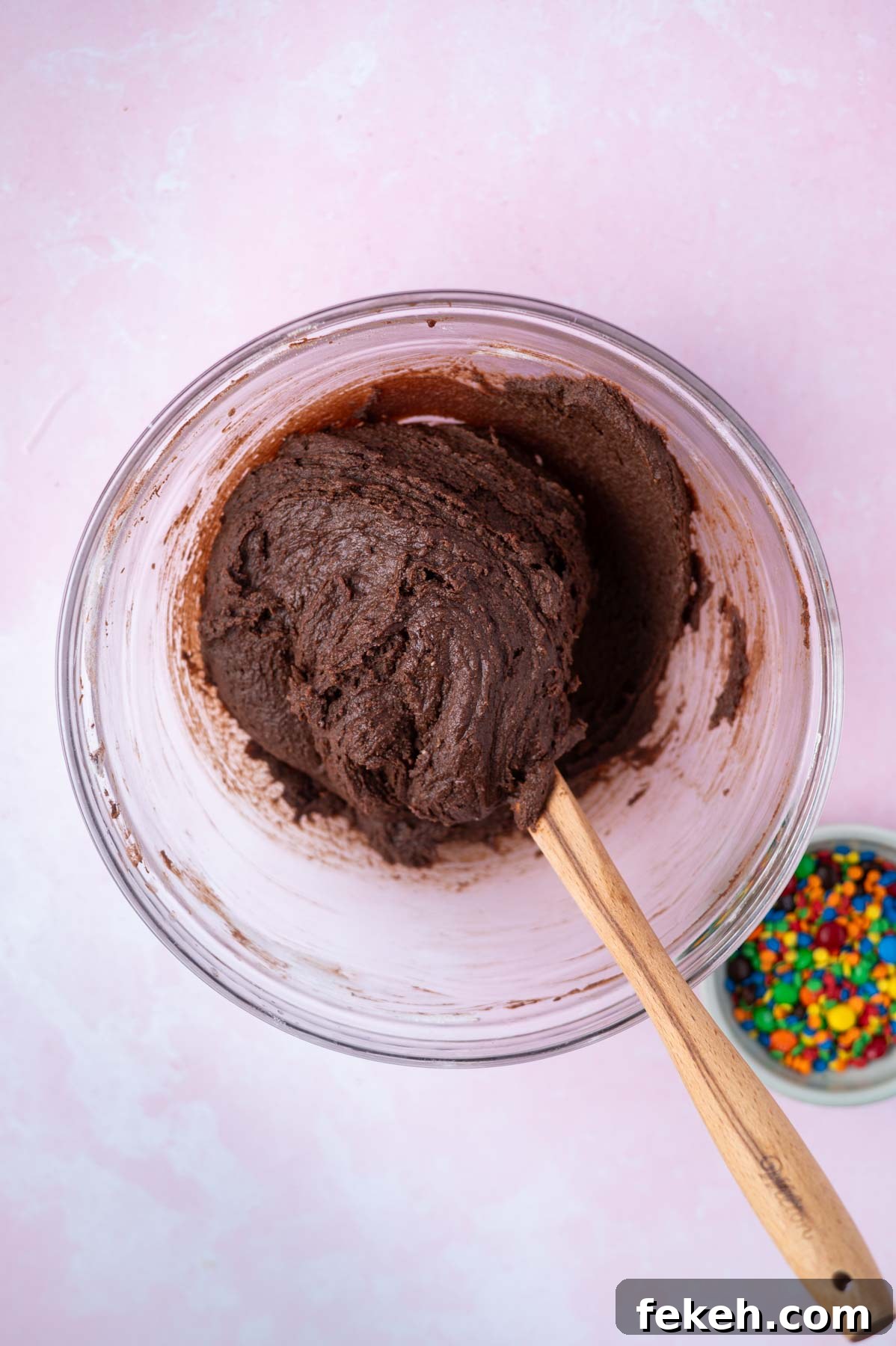 Fudgy Cosmic Brownie Cookie Recipe for Gooey Chocolate Lovers 8 brownie cookie dough in a bowl with a spatula