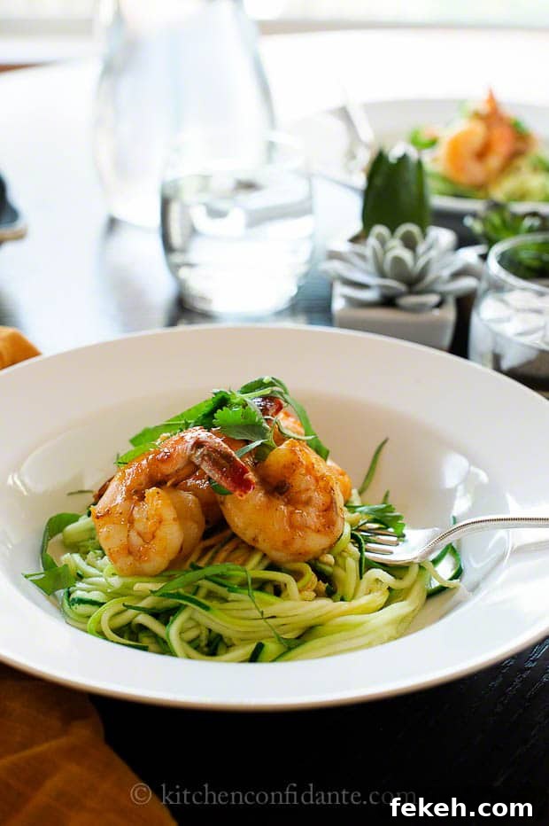 Spicy Shrimp with Zucchini Noodles | Kitchen Confidante A pasta bowl full of zucchini noodles topped with shrimp.