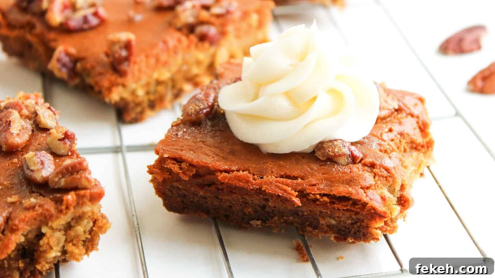 I Tried 15 Fall Snacks So You Don’t Have To — Top Picks Reviewed 7 A square piece of pumpkin dessert bar topped with a swirl of white frosting and pecans sits on a cooling rack.