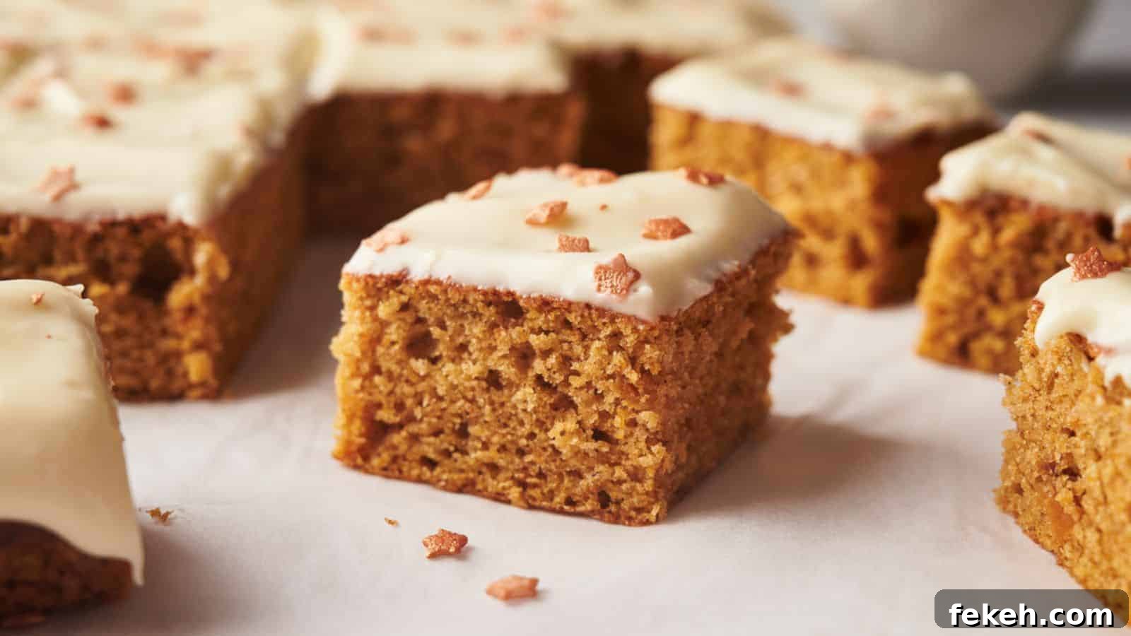 I Tried 15 Fall Snacks So You Don’t Have To — Top Picks Reviewed 10 A group of pumpkin bars with icing on top.