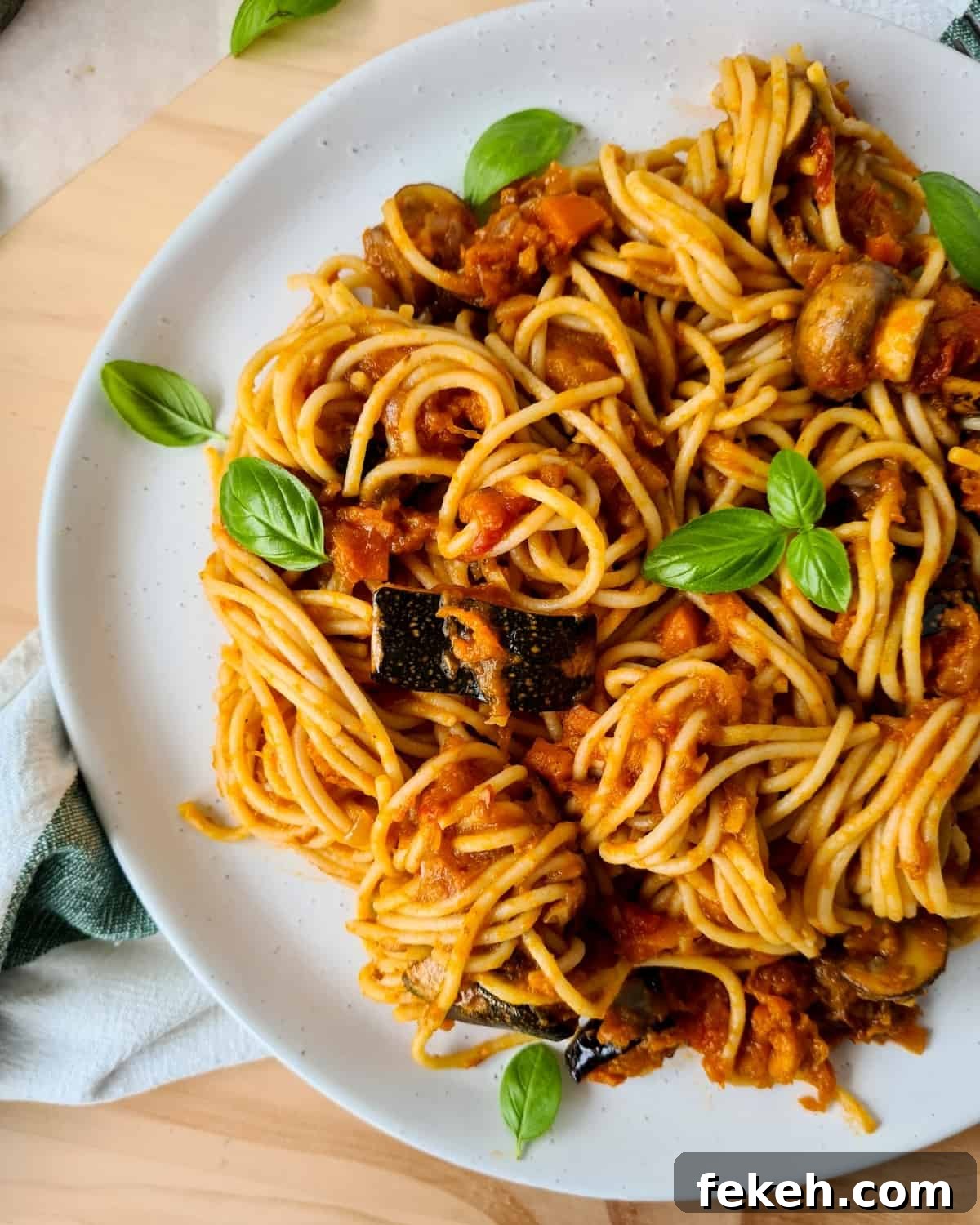Roasted Pumpkin Vegetarian Bolognese Recipe for Cozy Dinners 8 Side image of plate of spaghetti vegetarian bolognese
