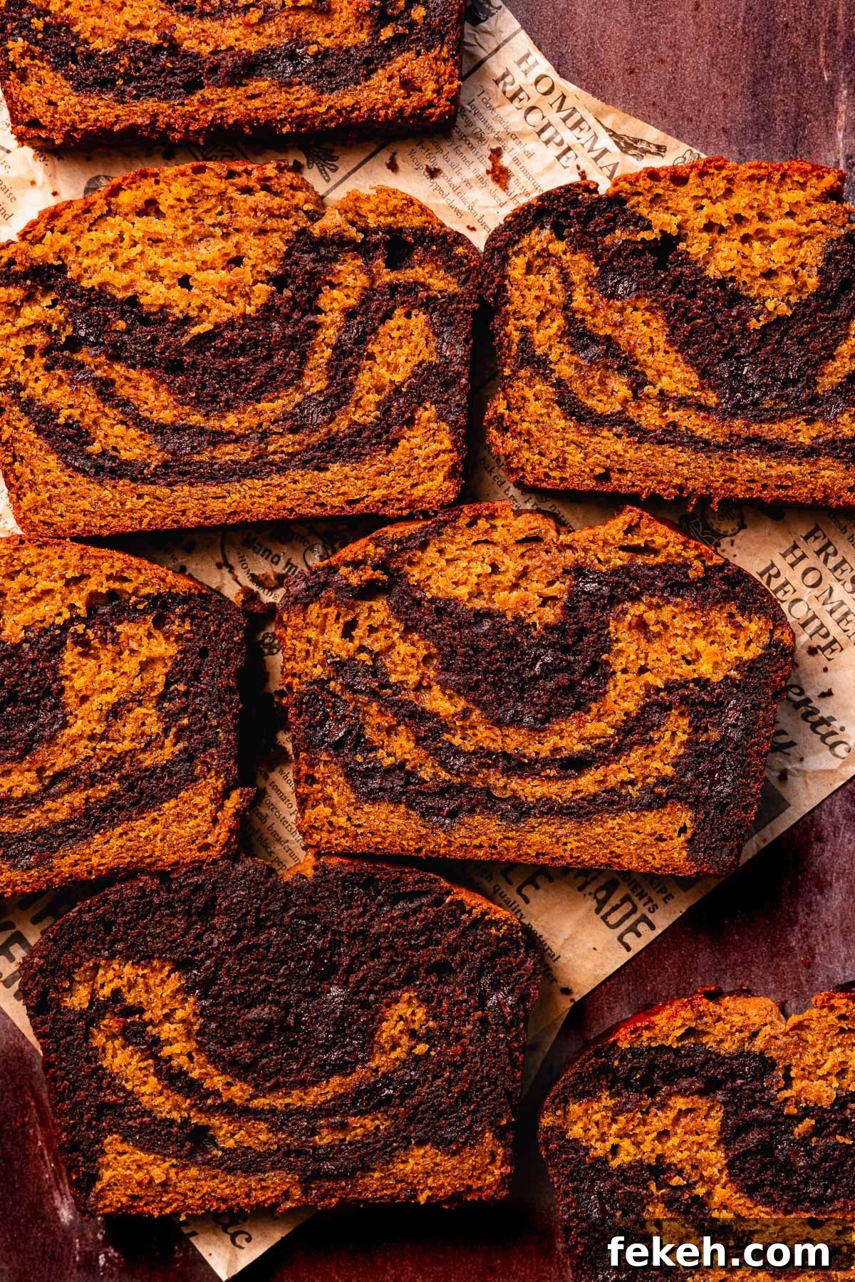 Pumpkin Chocolate Loaf with Spiced Chocolate Chips 2 slices of pumpkin and chocolate bread with swirls and chocolate chips