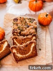 pumpkin cream cheese bread with pumpkin seed streusel topping