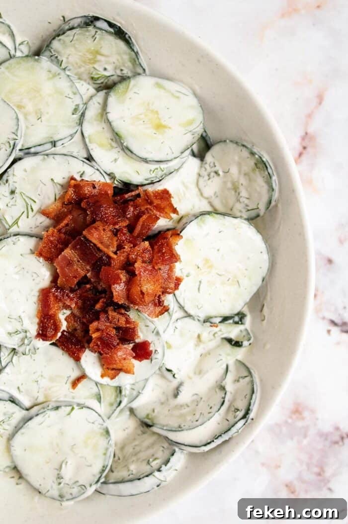 Low-Carb Keto Taco Salad Recipe for Quick Weeknight Meals 18 overhead view of keto cucumber salad with crumbled bacon on top
