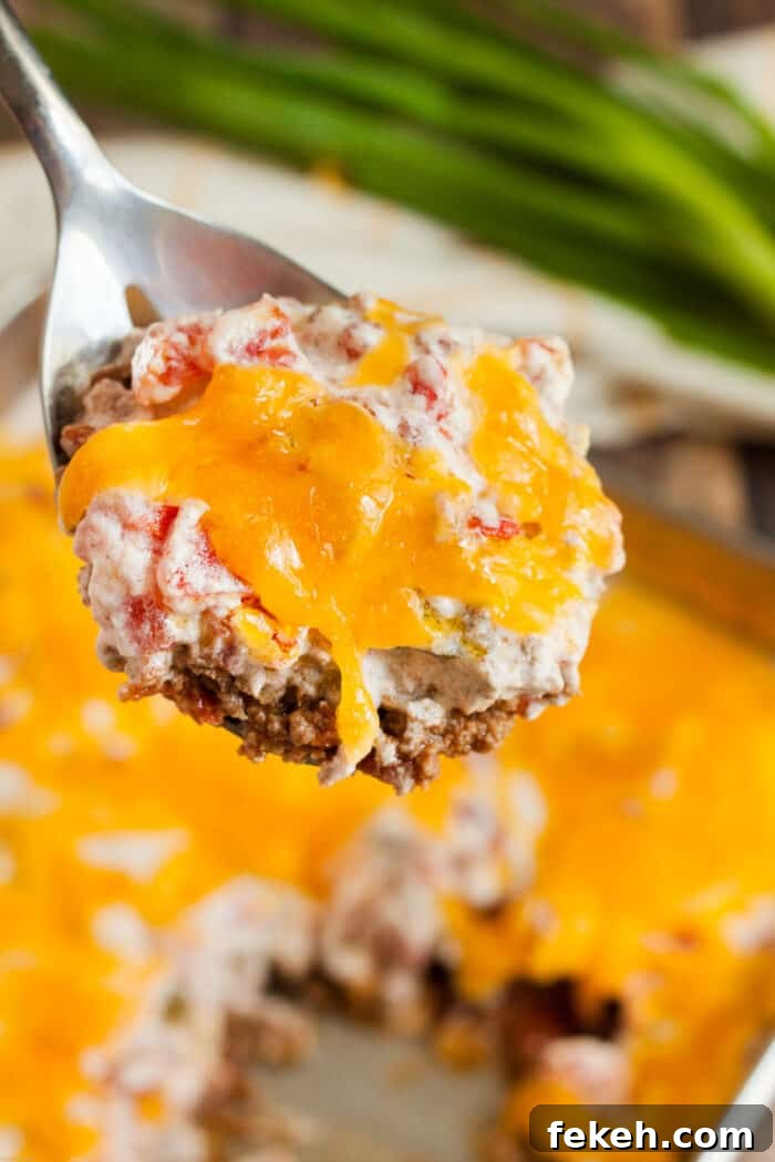 Low-Carb Keto Taco Salad Recipe for Quick Weeknight Meals 23 keto casserole beef and tomato on spoon being served