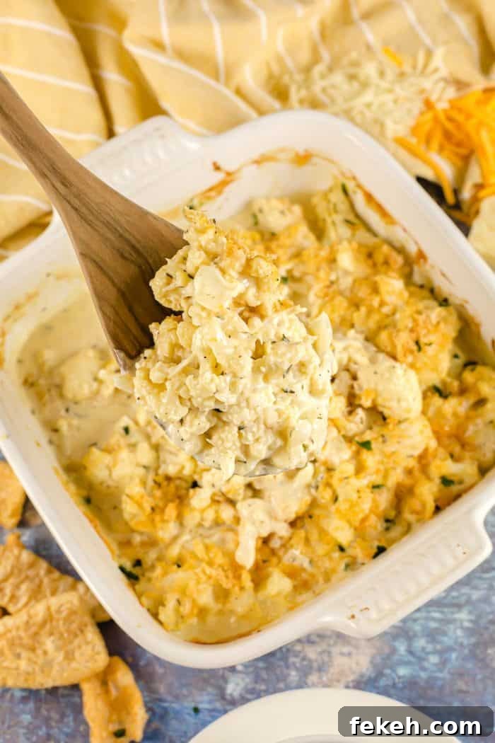 Low-Carb Keto Taco Salad Recipe for Quick Weeknight Meals 26 wooden spoon with part of keto cauliflower mac and cheese on it