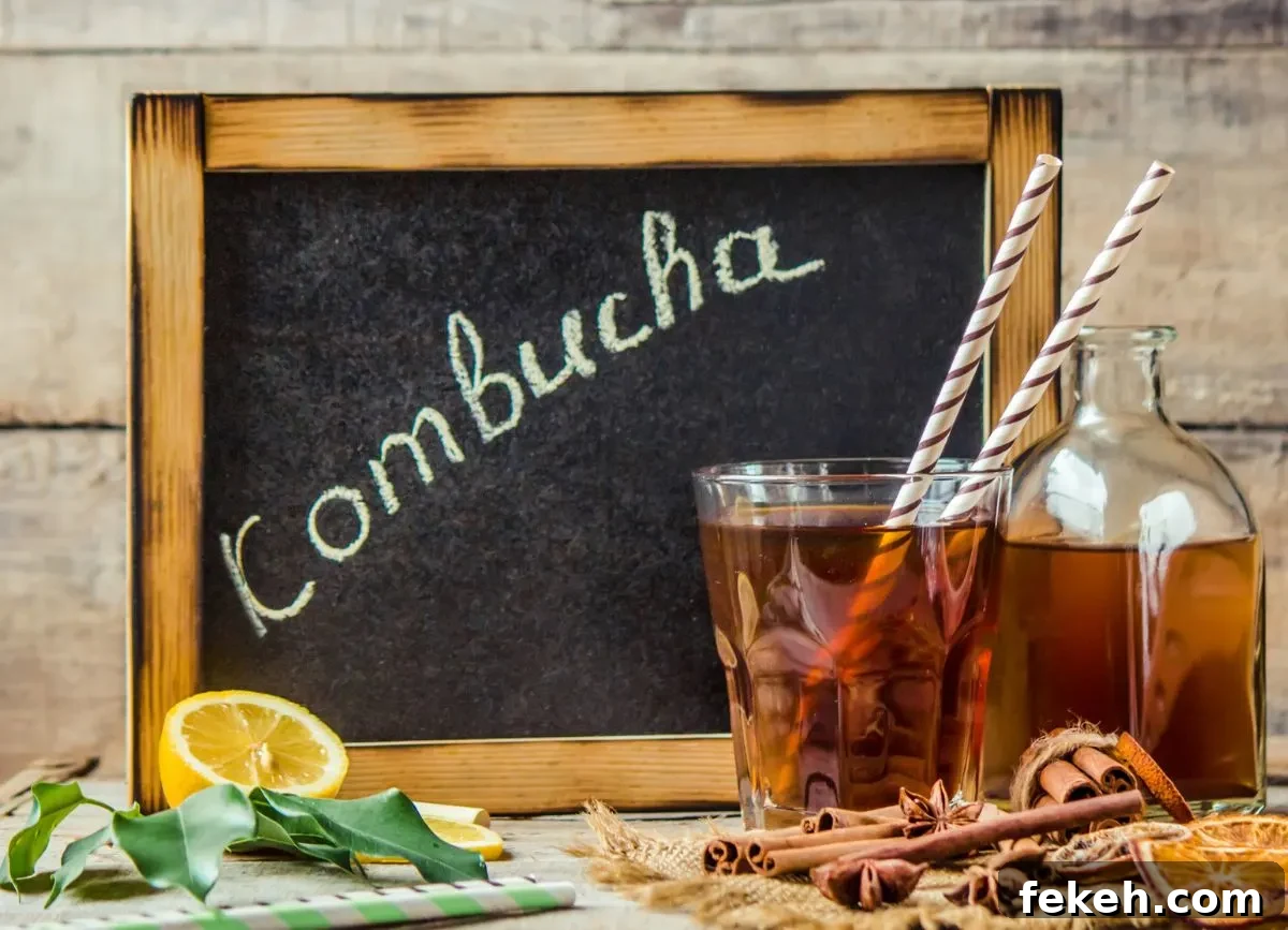 Is Kombucha Gluten-Free? What You Need to Know About Gluten in Kombucha 4 A chalkboard that says kombucha with a glass of it and straws.