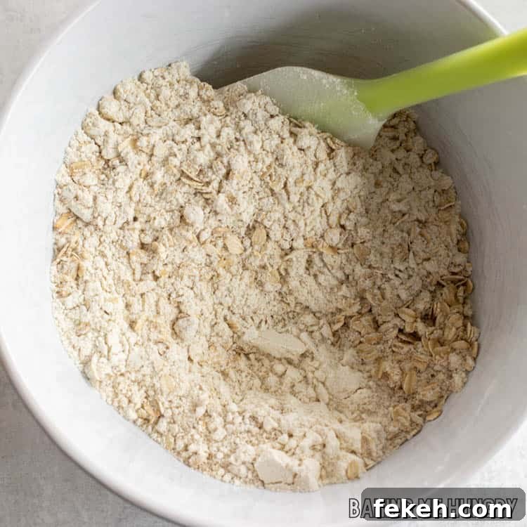 Peanut Butter Banana Oat Oatmeal Bars — Chewy Snack Squares 5 dry ingredients in bowl