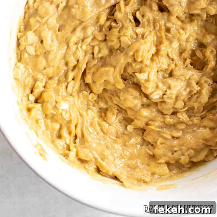 Peanut Butter Banana Oat Oatmeal Bars — Chewy Snack Squares 7 batter in bowl