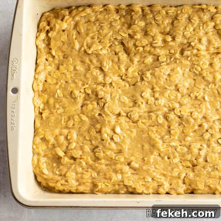 Peanut Butter Banana Oat Oatmeal Bars — Chewy Snack Squares 8 batter in pan