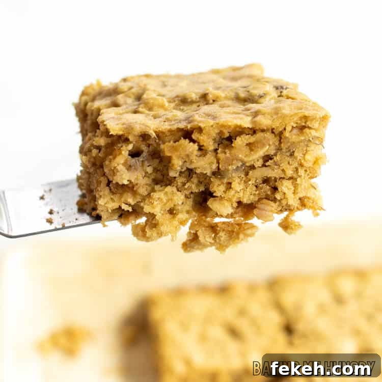 Peanut Butter Banana Oat Oatmeal Bars — Chewy Snack Squares 10 stacked peanut butter banana oatmeal bars