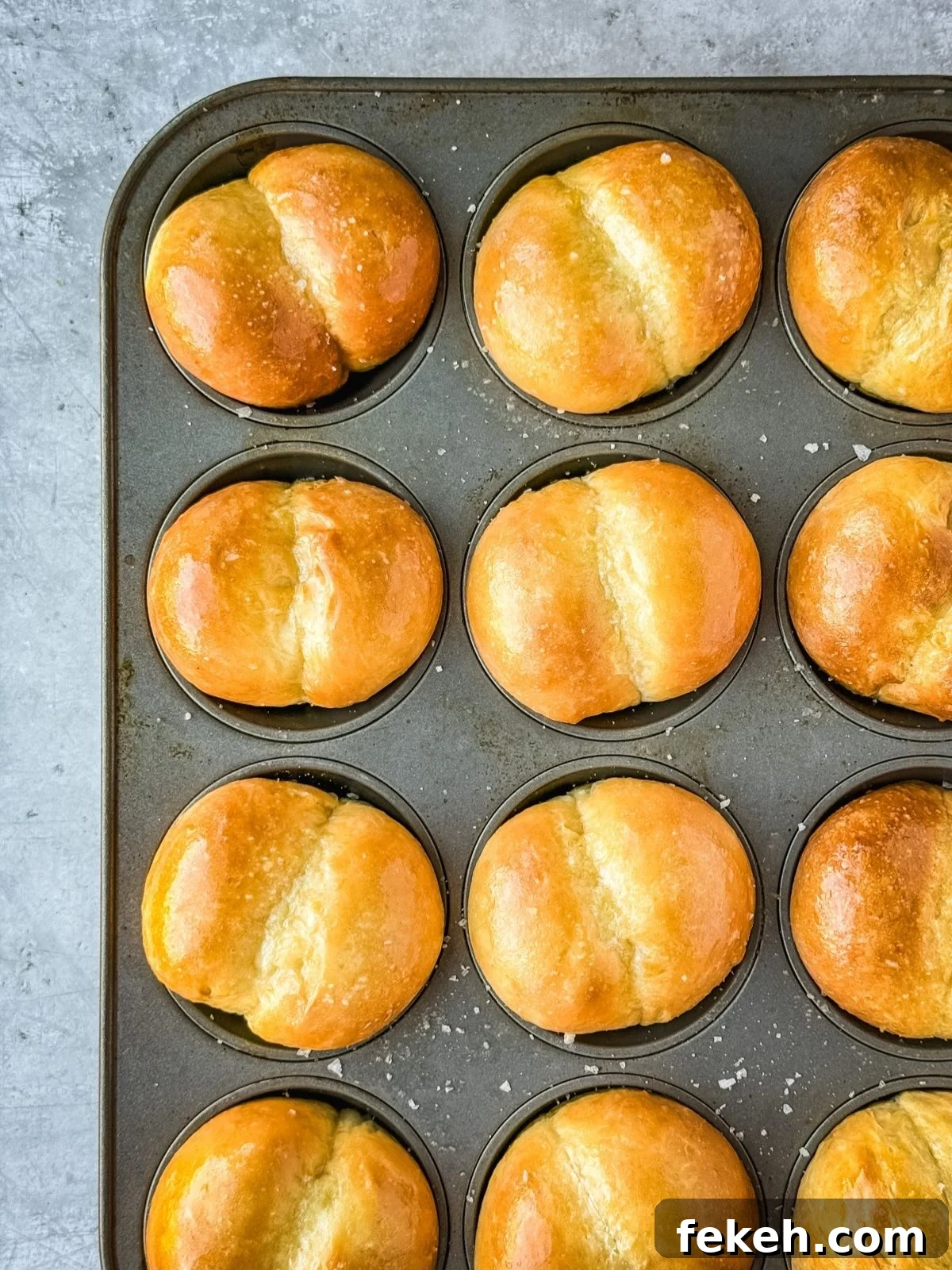 Soft Buttery Double-Cheek Dinner Rolls Recipe 2 Double cheeked buns in a muffin tin.