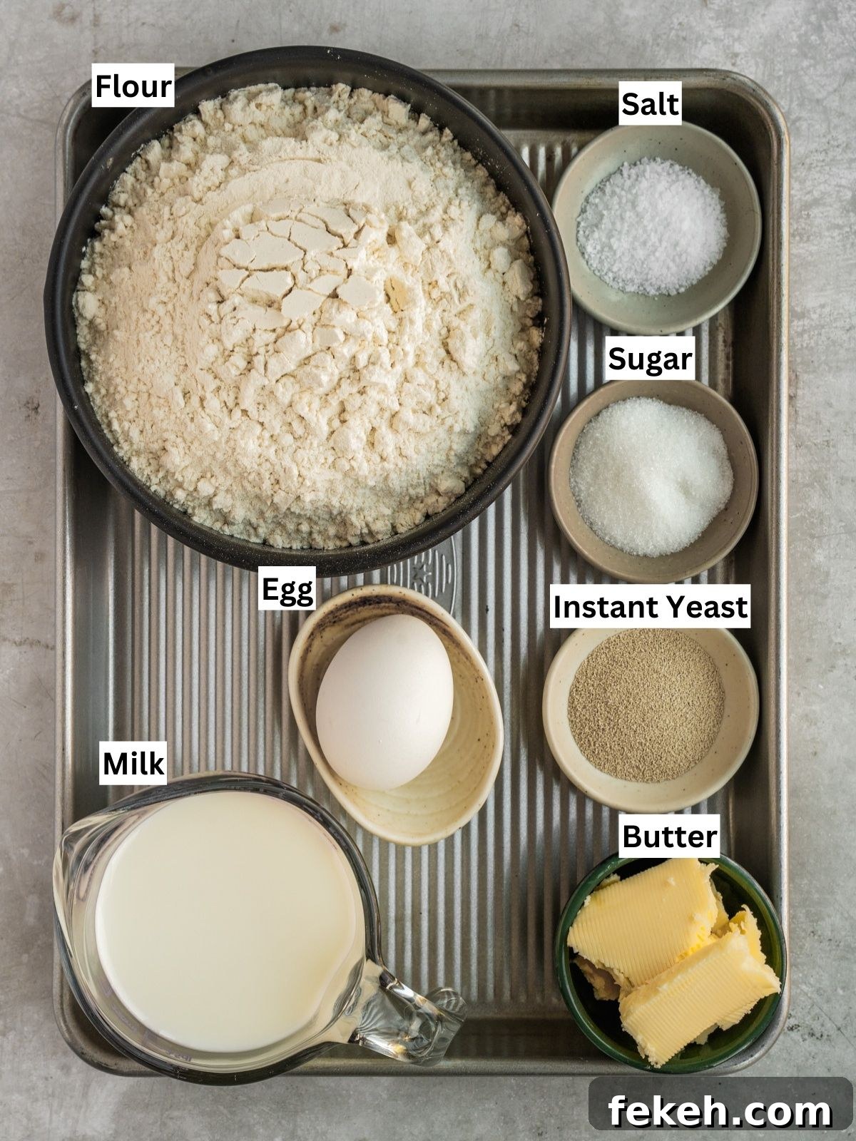 Soft Buttery Double-Cheek Dinner Rolls Recipe 4 Double cheeked buns recipe ingredients with individual labels on a metal tray.