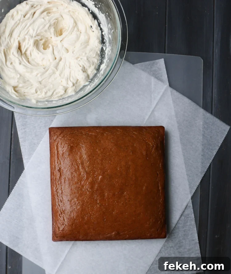 Pumpkin Olive Oil Cake — Eggless, Dairy-Free, Butter-Free Recipe 8 A square crazy pumpkin olive oil cake on parchment paper next to a bowl of frosting