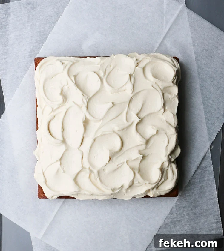 Pumpkin Olive Oil Cake — Eggless, Dairy-Free, Butter-Free Recipe 13 Swirled Whipped Maple Cream Cheese frosting on top of a square crazy pumpkin olive oil cake