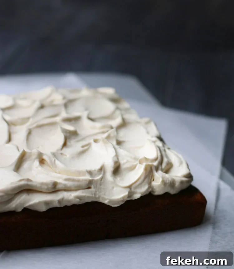 Pumpkin Olive Oil Cake — Eggless, Dairy-Free, Butter-Free Recipe 14 A corner angle view of and iced crazy pumpkin olive oil cake