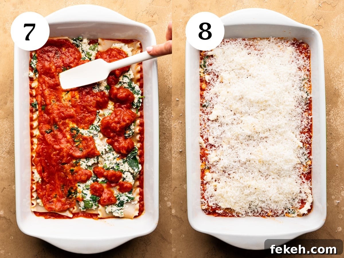 Creamy Spinach Lasagna Recipe with Ricotta and Mozzarella 6 Close up of lasagna being baked in a white dish.